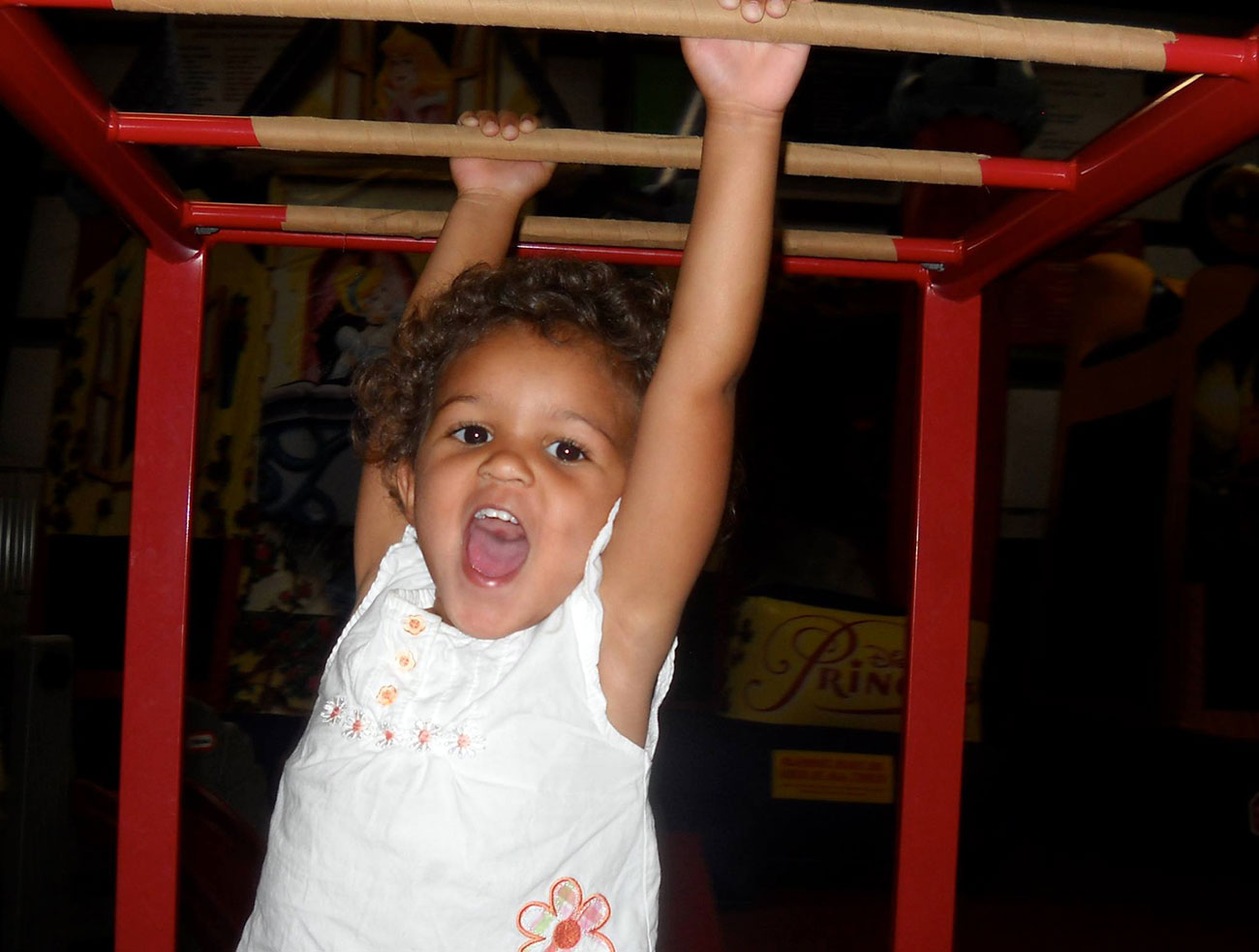 A student has fun on the monkey bars